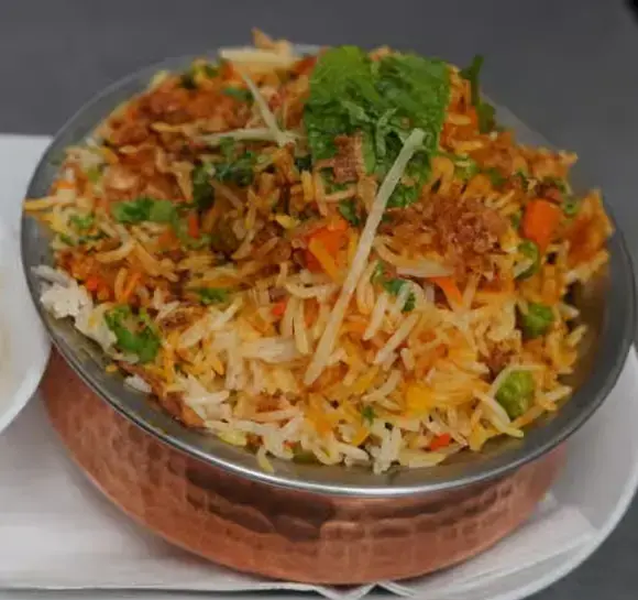 Chicken Biryani at The Social Kabob Okotoks - aromatic basmati rice with chicken and spices