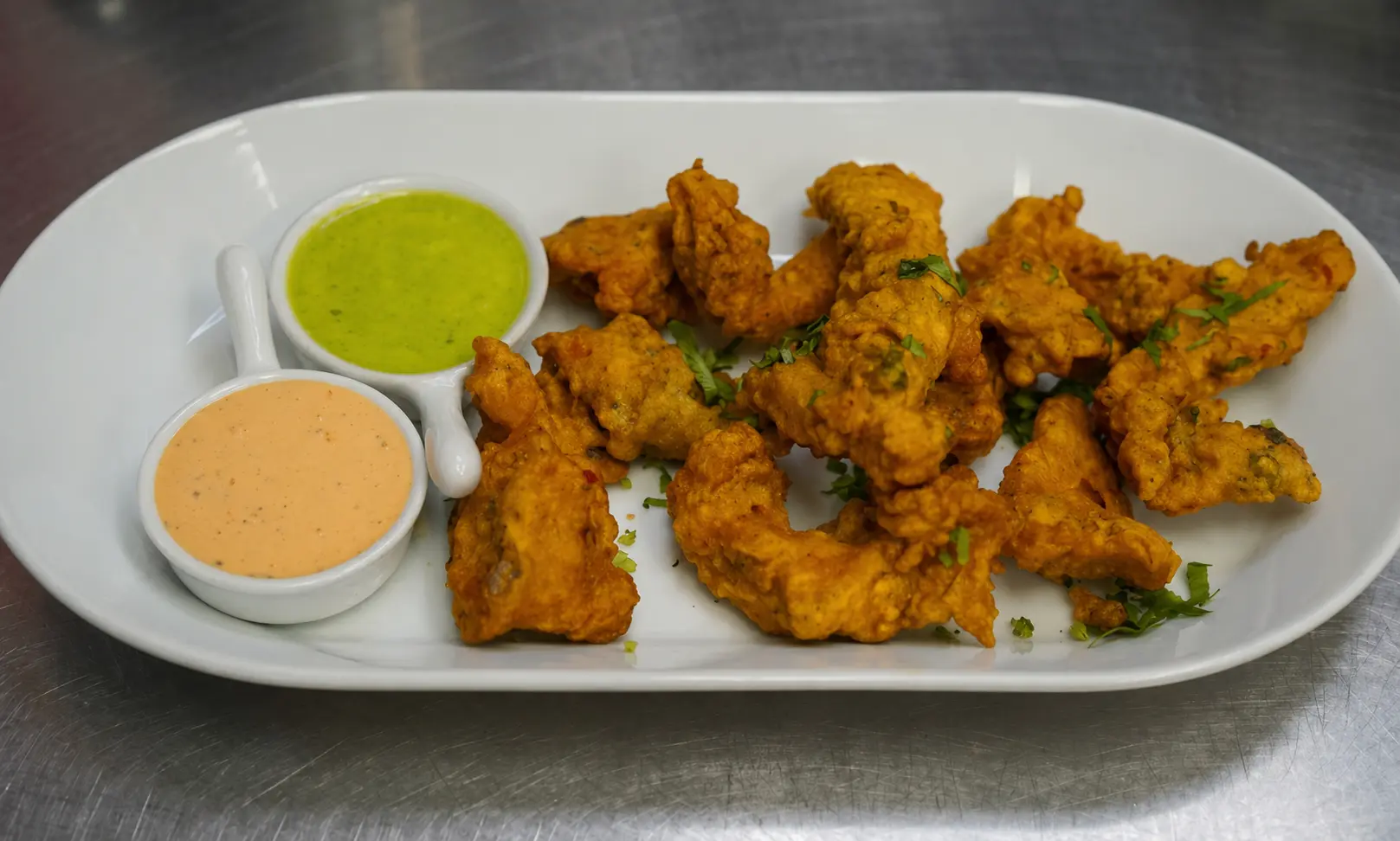 Chicken Pakora at The Social Kabob Okotoks - crispy spiced chicken fritters with mint chutney
